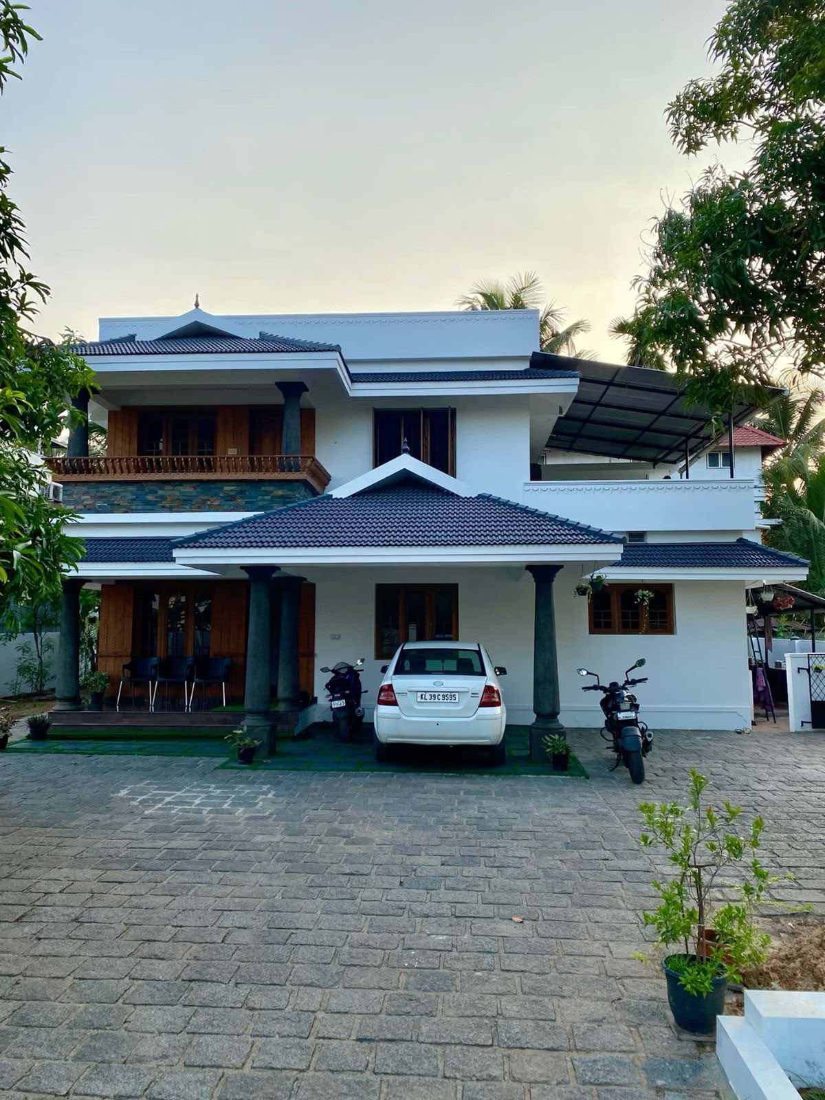 Cost-Effective Dual-Story Gated Villa with Linear Illumination